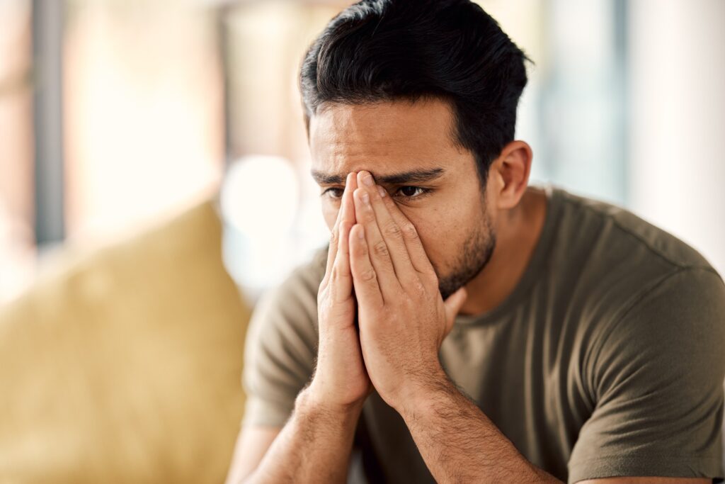 Man with trauma, stress and mental health problem, therapy and psychology, depressed and thinking a