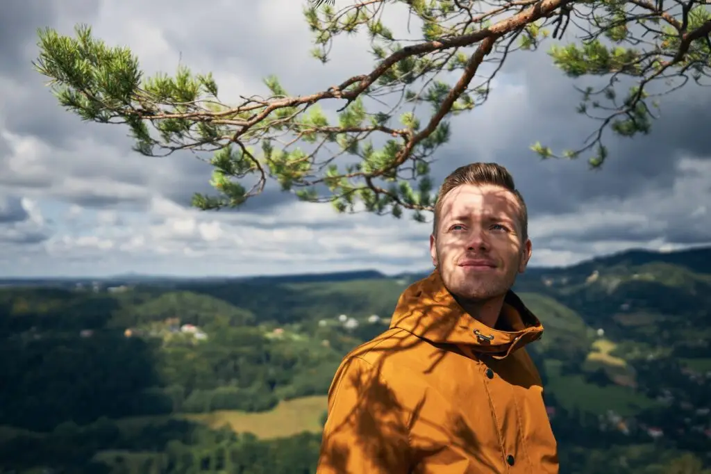 Portrait of cheerful man in nature