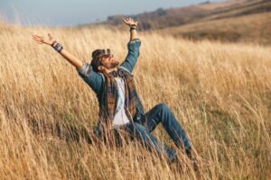 Young happy man in nature without guy's problems.