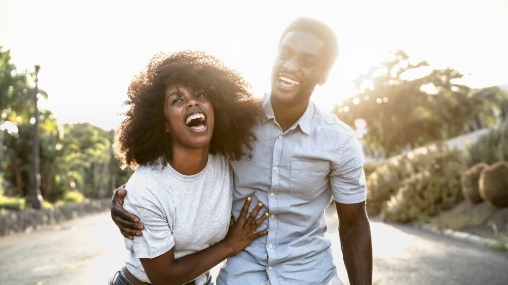 Happy African couple having fun dating outdoor