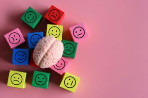 Human brain with happy, neutral and sad icon.